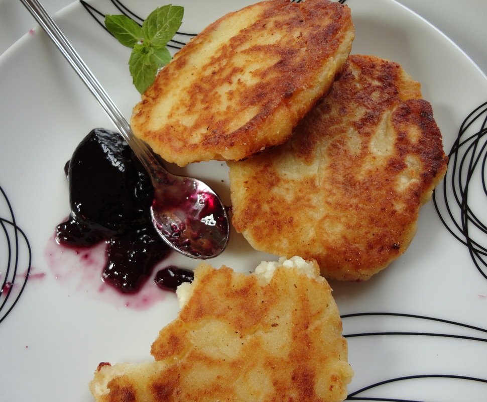 Curd cheese patties with some blueberry fruit spread